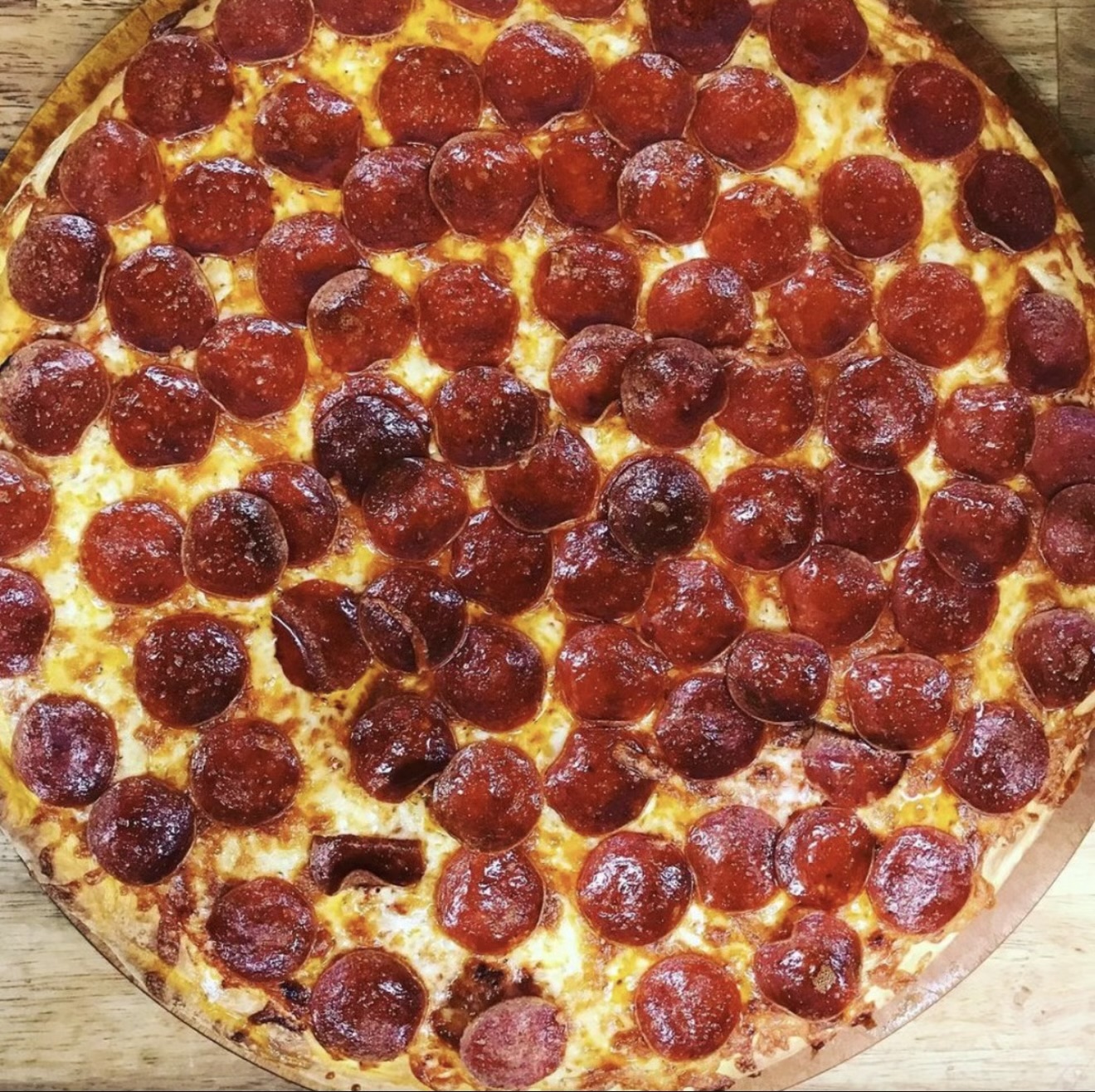 Golden hand-tossed pizza topped with melted cheese and pepperoni